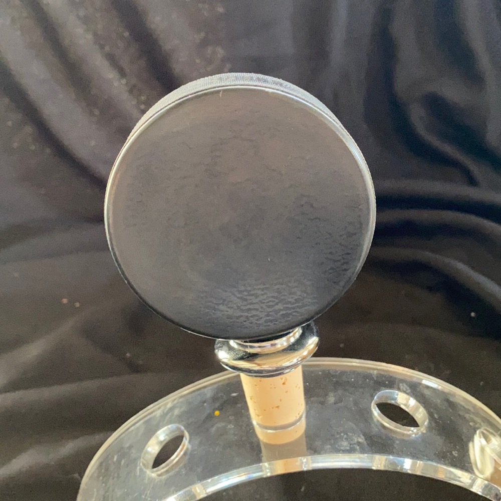 Hockey puck bottle stopper